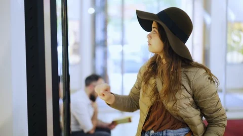 Girl using touchscreen terminal in mall Stock Footage 117468177