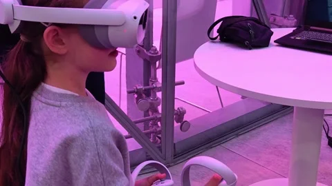 Girl using virtual reality glasses as part of information technology lesson. Stock Footage 310794892