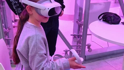 Girl using virtual reality glasses as part of information technology lesson. Stock Footage 312430154