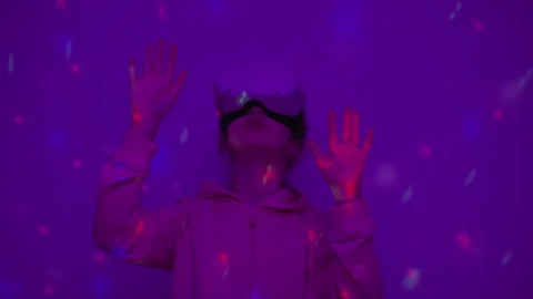 Girl Using Virtual Reality Headset And Looking Around At Interactive Techno.. Stock Footage 345750222