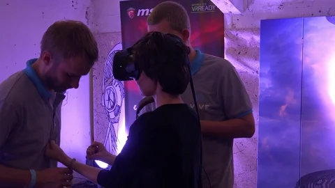Girl using virtual reality HTC game development kit, virtual reality glasses in Stock Footage 83222050