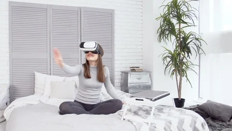 Girl using VR glasses in front of computer. Stock Footage 88155883