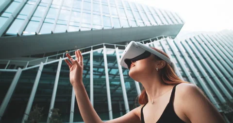 Girl using vr goggles while walking in the city Stock Footage 201679797