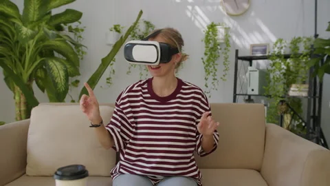 Girl Using VR Headset when Testing Application Stock Footage 276888807