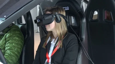 Girl in virtual glasses headset testing Vodafone 5G-based communications systems Stock Footage 74112334