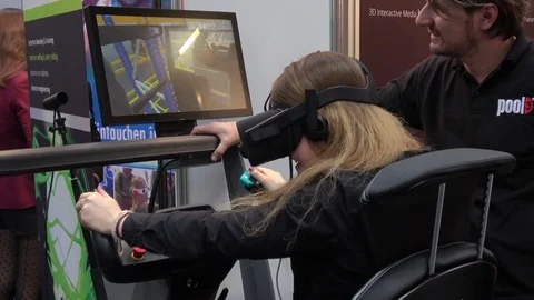 Girl in virtual reality headset on training VR simulator on exhibition Cebit Video stock 74572017