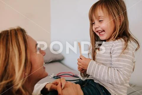 Girl visiting her pediatrician for throat checkup Stock Photos