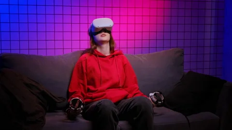 Girl in VR glasses plays video game feeling sad of losing Stock Footage 201504853