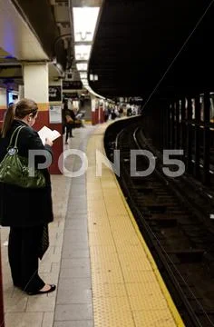 Girl Waiting in the Subway in NYC Stock Photos
