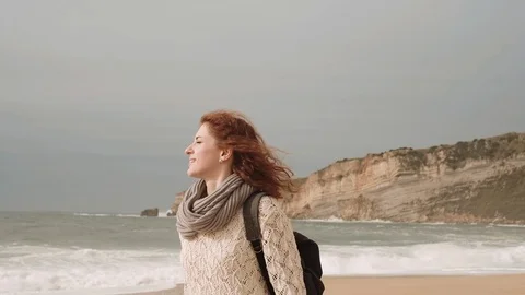 Girl Walking Alone On Empty Seashore In Cloudy Cold Weather. Stock-Footage 107722245