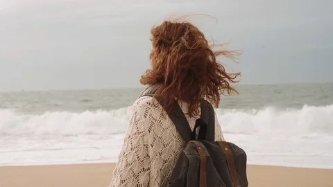 Girl Walking Alone On Empty Seashore In Cloudy Cold Weather. Stock Footage 107722406