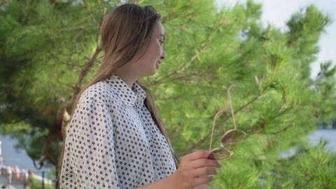 Girl walking and making a pause to enjoy sea view Stock Footage 124407045