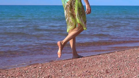 Girl walking on the beach Stock Footage 95268694