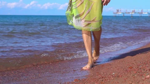 Girl walking on the beach Stock Footage 96199054