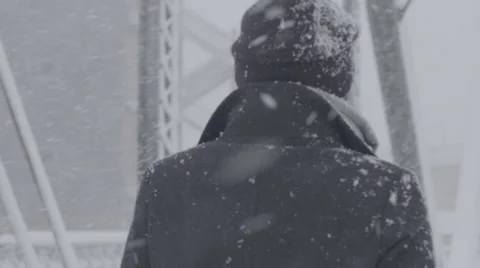 Girl walking in a blizzard Stock Footage 61472601