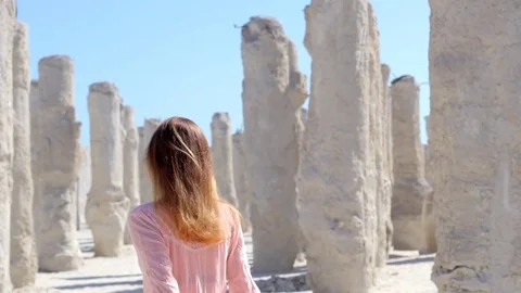 Girl walking on the a column beach Stock Footage 76176960