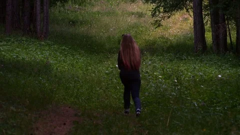 Girl is walking down the path Stock-Footage 80437375