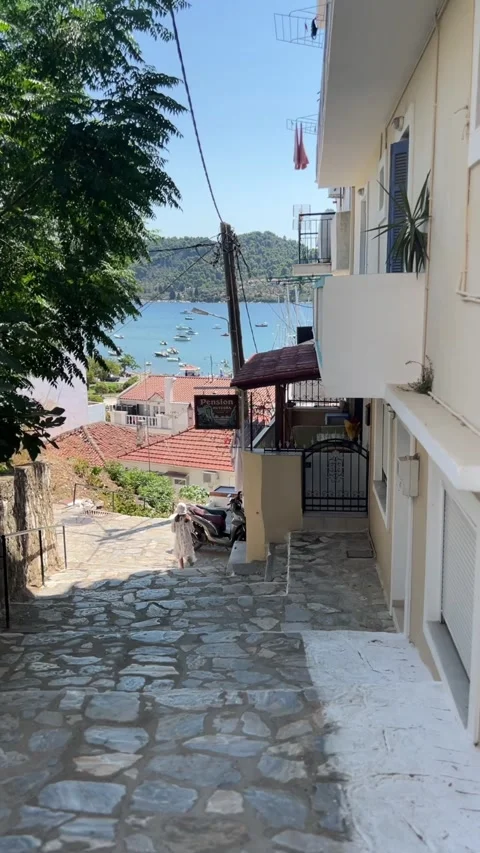 Girl Walking Down Stone Steps in Skiathos, Greece Stock Footage 313237224