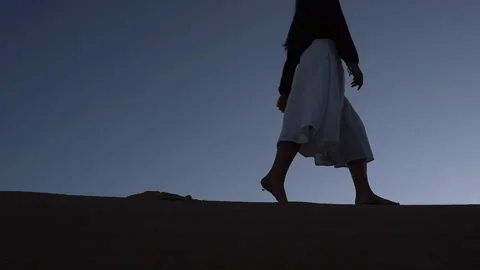 Girl walking on a dune Stock Footage 199210283