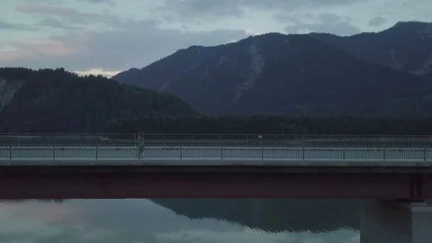 Girl is walking on the empty bridge and enjoying the view - Aerial Stock Footage 83751282