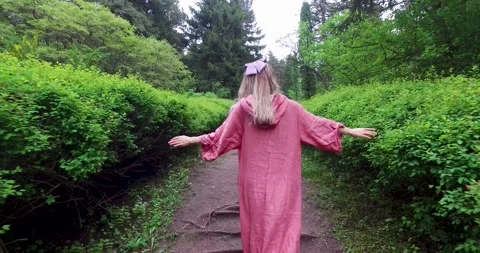 The girl is walking in the forest Stock Footage 245707005