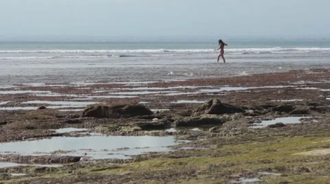 Girl Walking on the Ocean Stock Footage 67528879