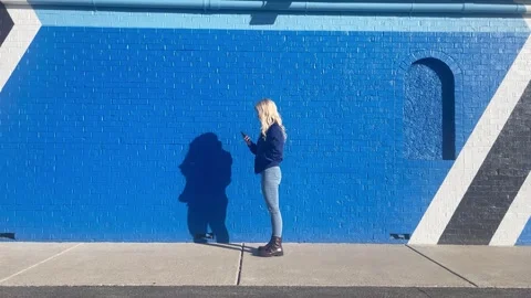 Girl Walking Outside and Checking Phone Message Stock-Footage 301130601