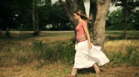 Girl walking in the pasture Stock Footage