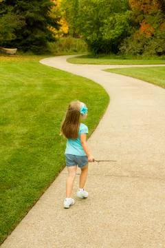 Girl walking a patch Foto stock