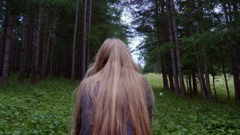 Girl is walking up the path Stock-Footage 80438114