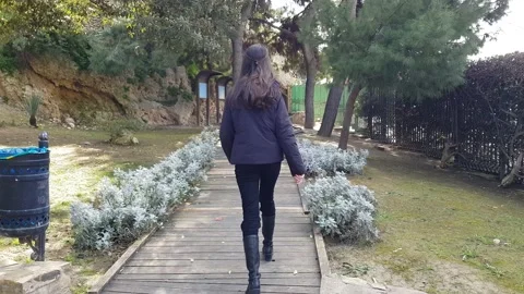 Girl walking on a path Stock Footage 201681546
