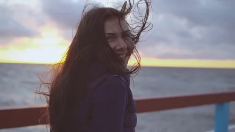 Girl is walking a pier on the sea Stock Footage