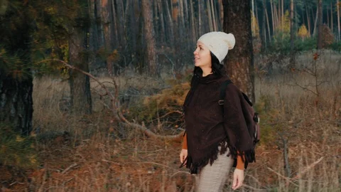 A girl walking in the pine forest Stock Footage 129320908
