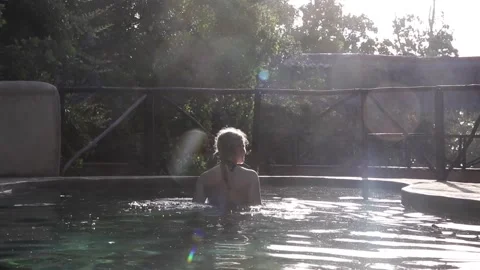 Girl walking in pool Stock Footage 170255209