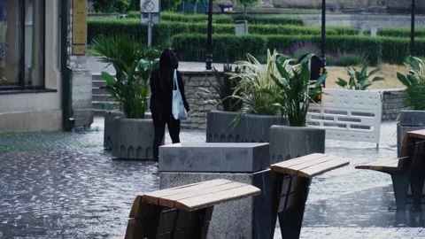 The girl is walking in the rain Stock Footage 274844067