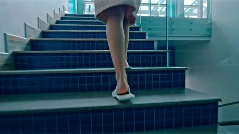 Girl Walking Up Stairs Stock Footage