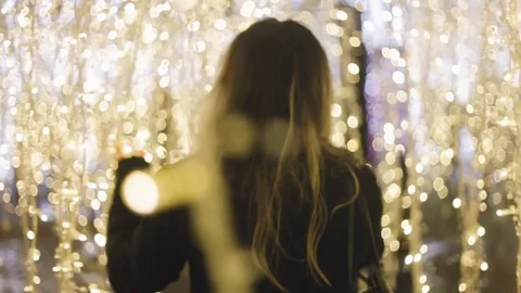 Girl walking through Strings of Lights - Enchant Vancouver Stock-Footage 71130768