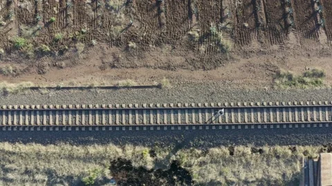 Girl Walking On train rail - Drone Stock Footage