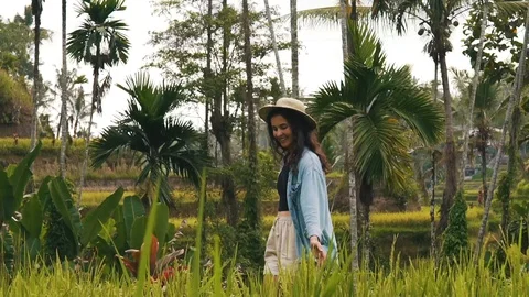 Girl is walking in Ubud Stock Footage 129057333