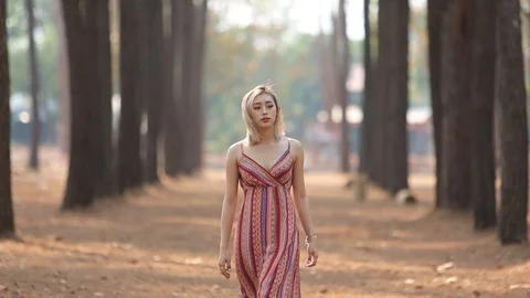 Girl walking in woods Stock Footage