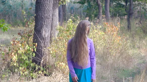 Girl walks in the park Stock Footage