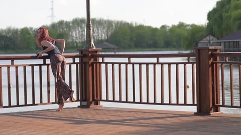 Girl walks on the pier Stock Footage 130640967