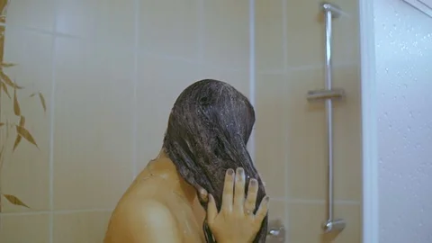 The girl washes in the shower Video stock 74028357