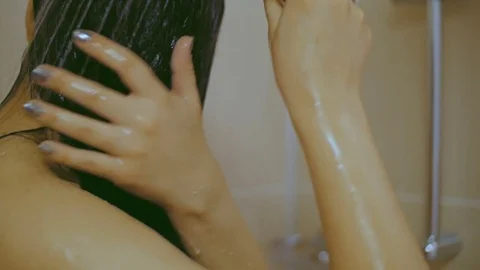 The girl washes in the shower Video stock 74032450