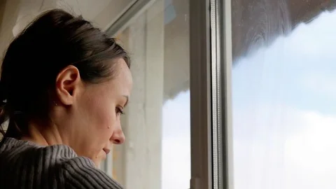 Girl washes a window Stock Footage 84107944