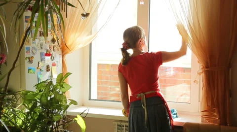 Girl washes the window, view from the back Stock Footage 42696736