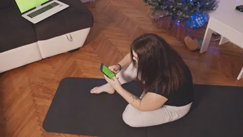A girl watching online tutorials on smartphone Video stock 145664535
