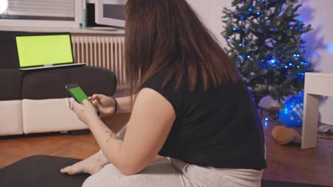 A girl watching online tutorials on smartphone Stock Footage 145664543