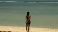 Girl watching the sea while low tide HD Footage