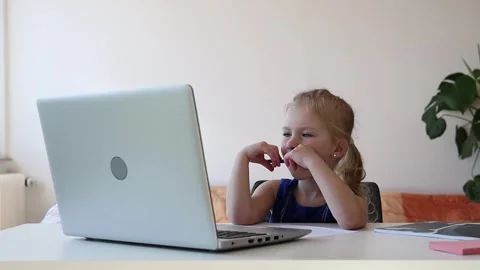 Girl watching video on the computer. Video stock 244008054
